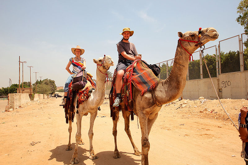 Bronwen & Ned ride camels in Cairo, Egypt