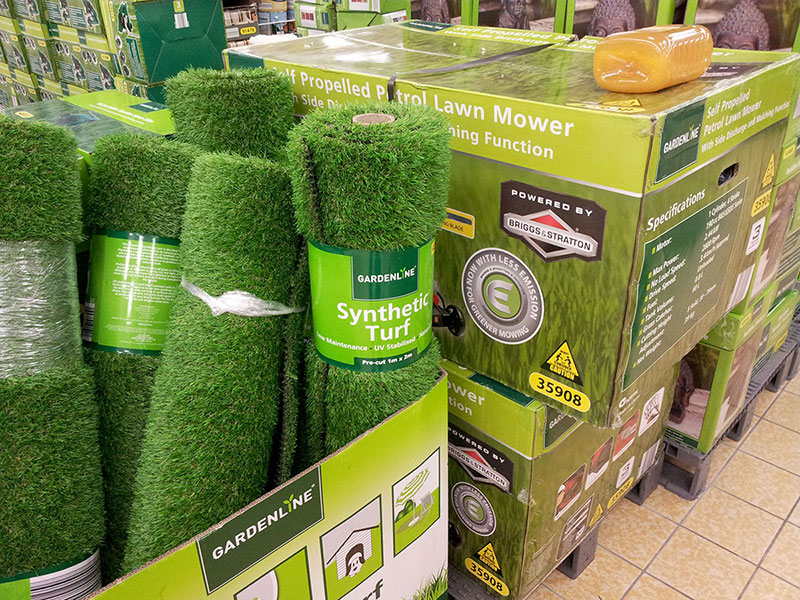 In an unprecedented attempt at logically organising their stock, ALDI has placed their lawnmowers next to their synthetic lawn!