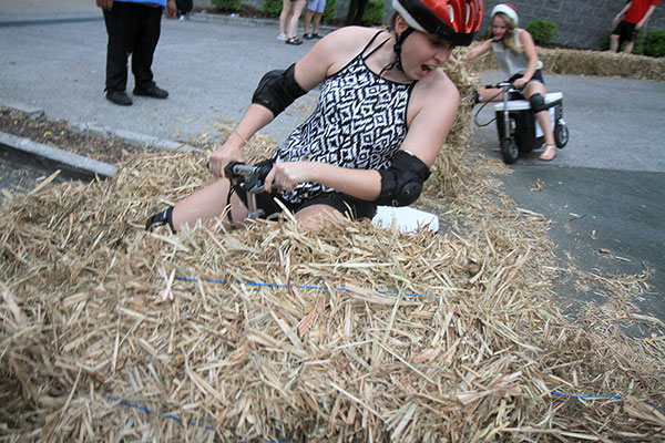 Almost all the women plowed into the hay on the second corner