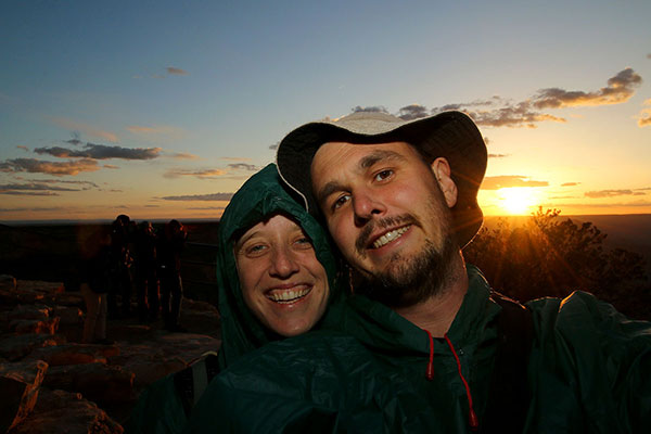 Bronwen & Ned freezing as the sun sets over the Grand Canyon