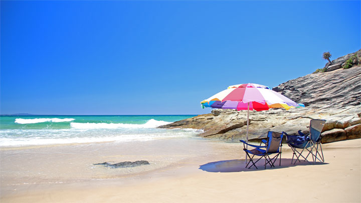 A lone umbrella — Home Beach