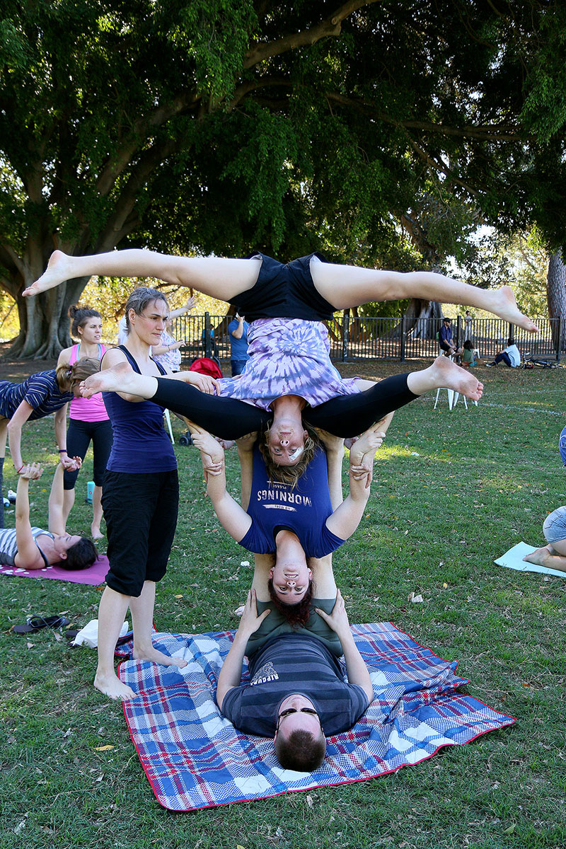 People standing on people’s heads, except upside down