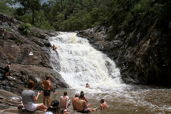 There were quite a few people at the swimming hole