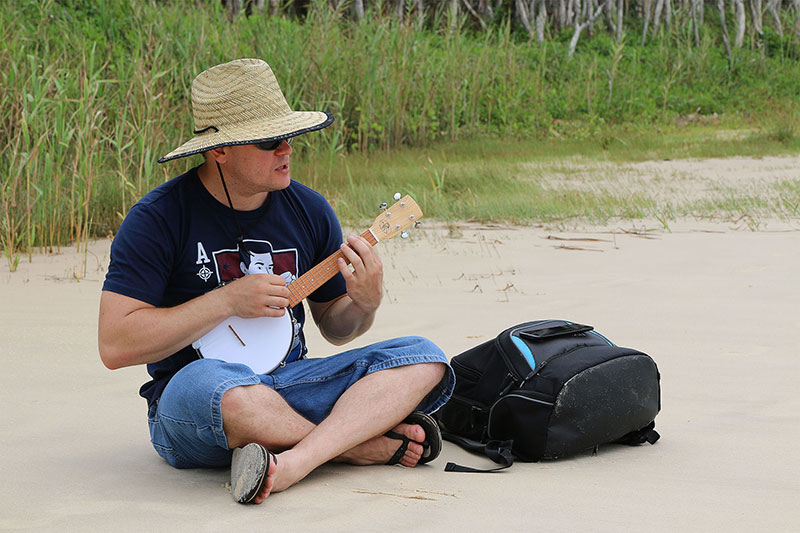 Chris plays his banjolele