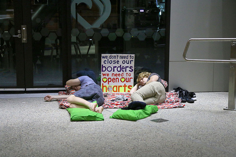 Protestors sleep at the Vigil for Baby Asha