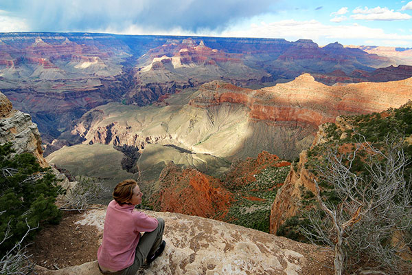 Bronwen watches clouds travel into the Grand Canyon