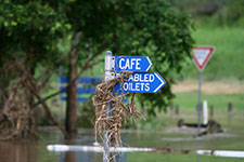 Debris in signs–Flooding of the Brisbane River at College’s Crossing