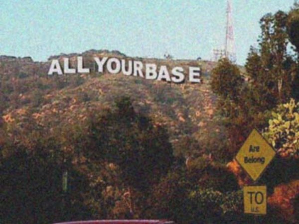 Hollywood style sign on hillside "All your base"