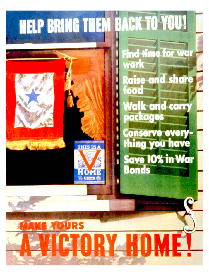 A blue star service flag hangs in a window