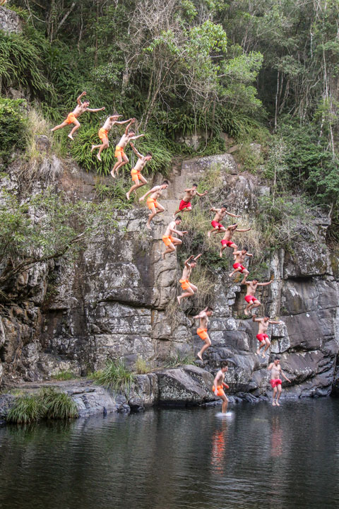 Boys jumping from rocks at Cedar Creek