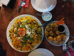 Vegetable biryani and paneer pakoras from Halim’s Indian Taj