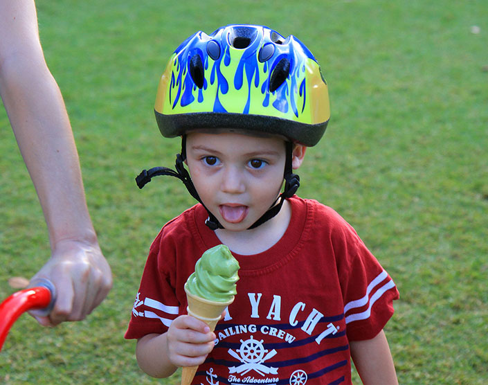 A child eats a tea-flavoured ice cream at The Japanese Festival