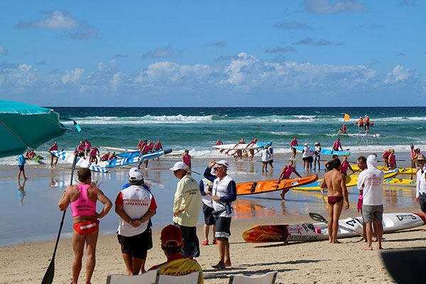 People pulling boats out of the water