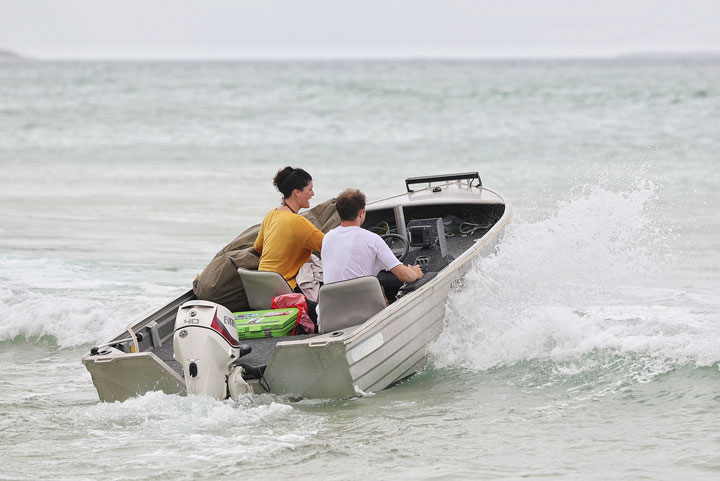 Carissa and Ben leaving in a boat, Stradbroke Island