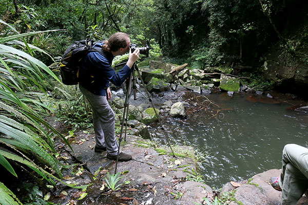 Maz photographing a waterfall