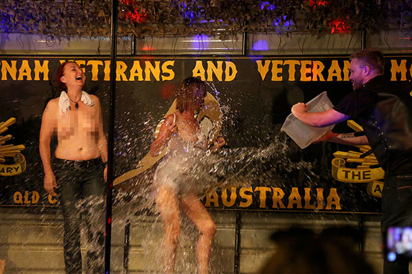 Demonstrating the “wet” part of the wet t-shirt competition