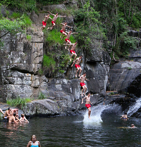 Jumping from rocks at Cedar Creek Falls