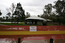“Temporary Park Closure. Park closed until further notice”–College’s Crossing in flood