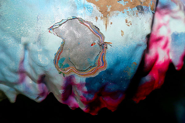 Many layers of paint on the cars at the Cadillac Ranch