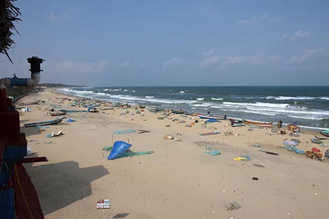 Lots of fishing boats and nets lay about the beach