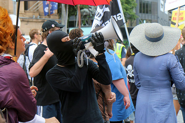 A communist advises bystanders not to support the scary and evil other side