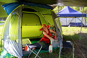 Bronwen unpacking things into our tent