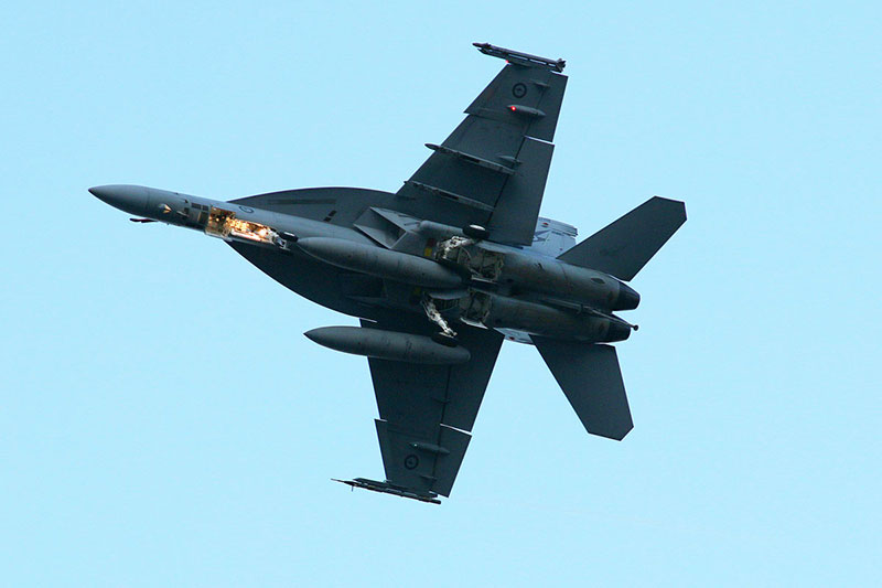 A Superhornet flies over the river