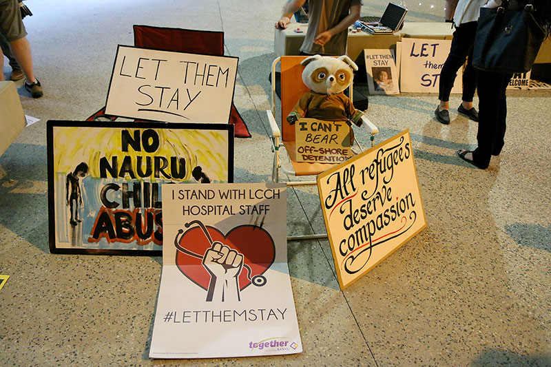 Signs at the Vigil for Baby Asha