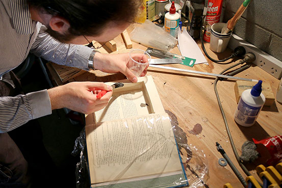 Gluing the insides of the cut part of the book