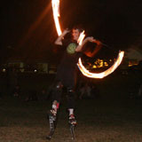 Fire twirling on stilts, Orleigh Park