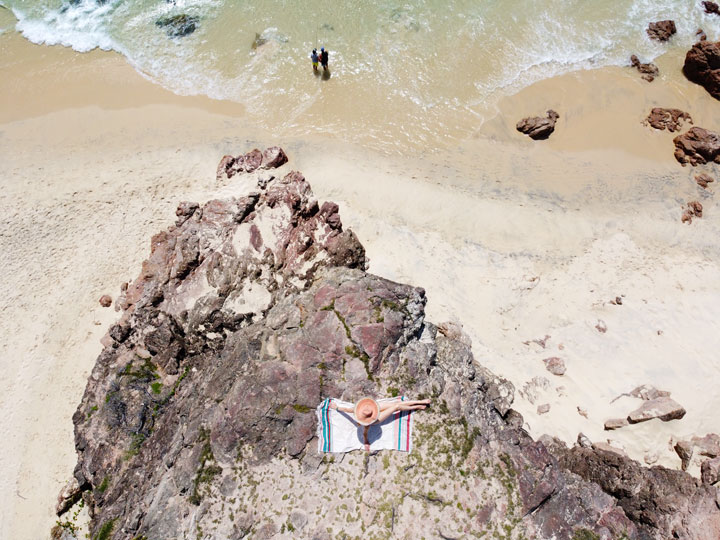 Bronwen sunbathing on a rock