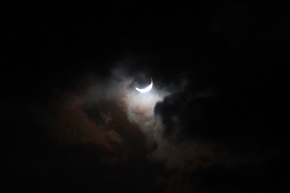 The eclipse through the clouds