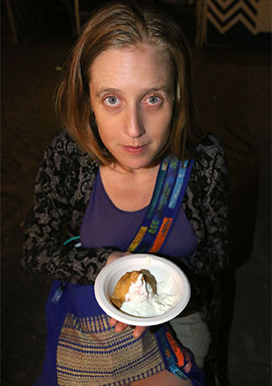 Bronwen with a vegetable samosa & yoghurt