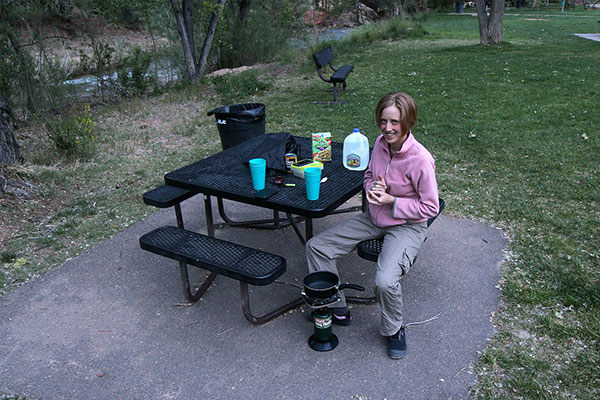 Bronwen cooking dinner in a park at Springdale