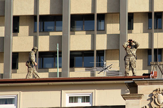 Snipers on the rooftop of the Treasury Hotel