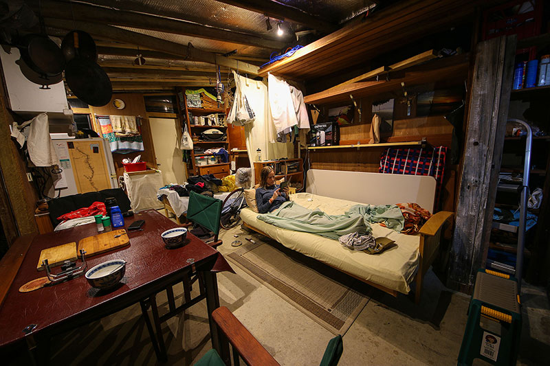 Bronwen reads her Kindle in “The Shed”