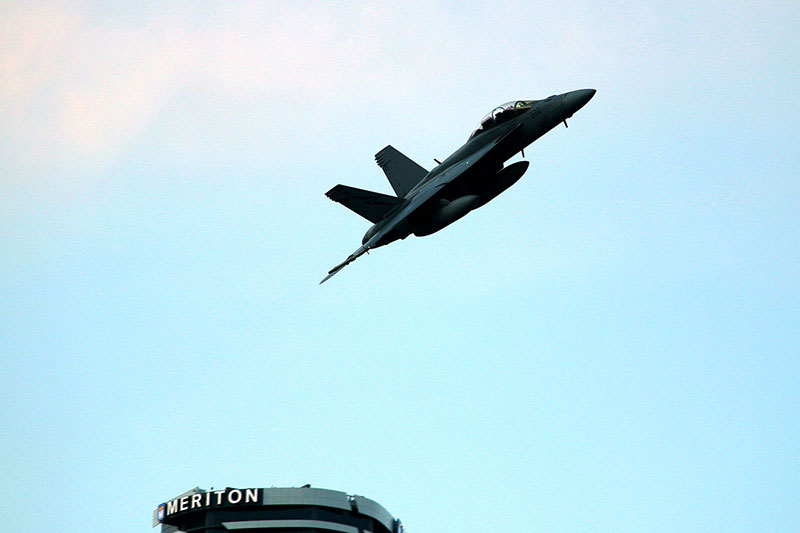 The superhornet flying above the city