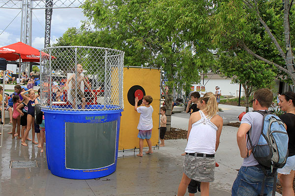 Children having fun dunking people at The Gasworks