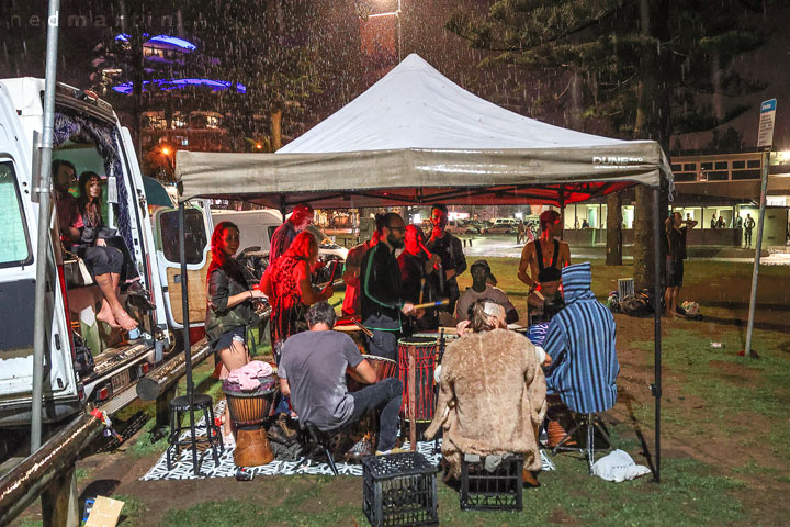 The drumming continues through the rain at Burleigh Bongos