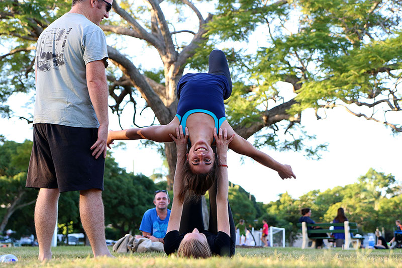 A woman happy upside down