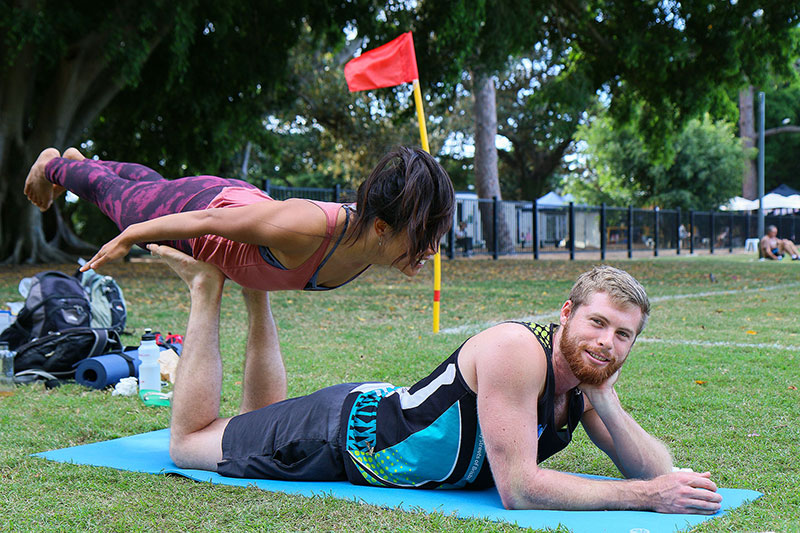 A man unaware there is a woman on him