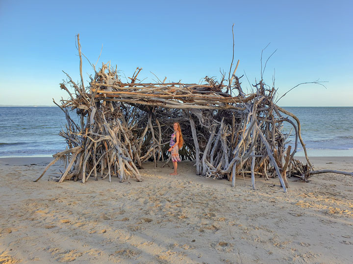 Bronwen inside a driftwood hut, Woody Bay, Bribie Island