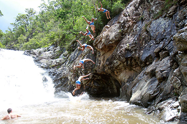 People took to jumping off the cliffs beside the swimming hole