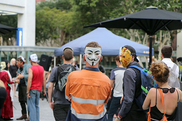 People listening to the speakers after the march