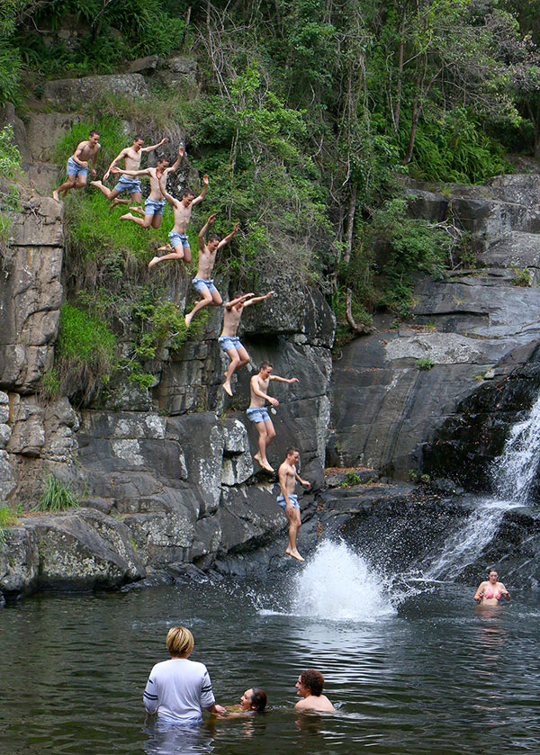 Jumping from rocks at Cedar Creek Falls