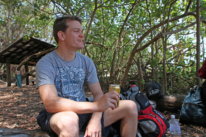 Chris with a can of XXXX beer he managed to get from a passerby, Moreton Island