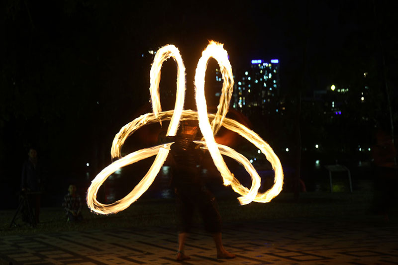 A professional fire twirler showing his stuff