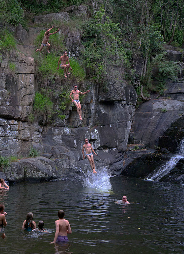 Jumping from rocks at Cedar Creek Falls