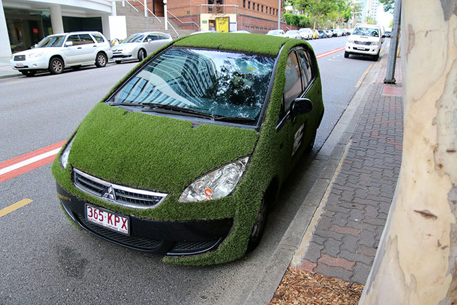 A grassy car in the city