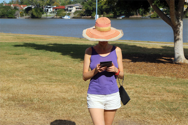 Bronwen reading her Kindle instead of looking at things